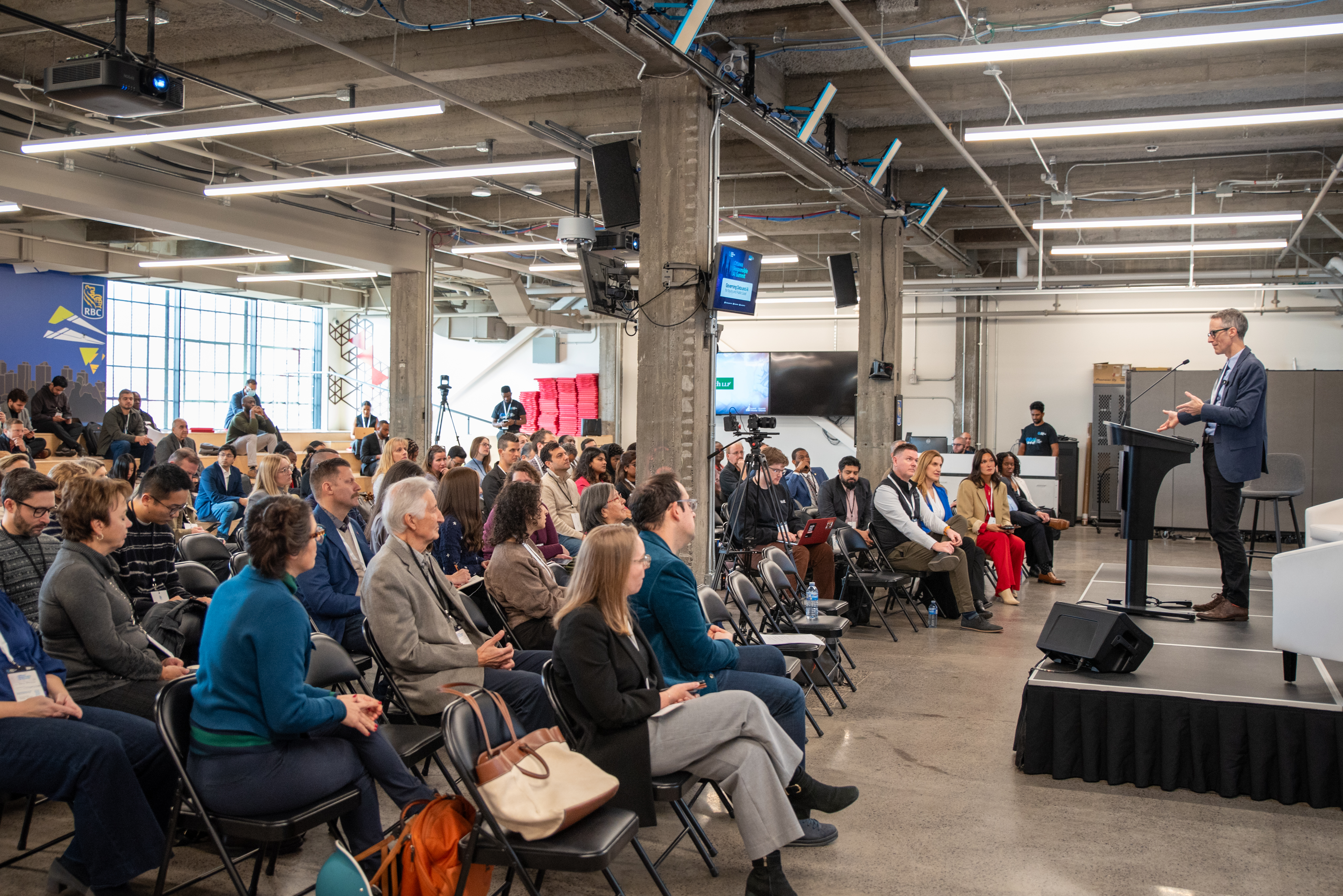 ORAIS 2025 — the full room during a keynote, with the stage and screens in view